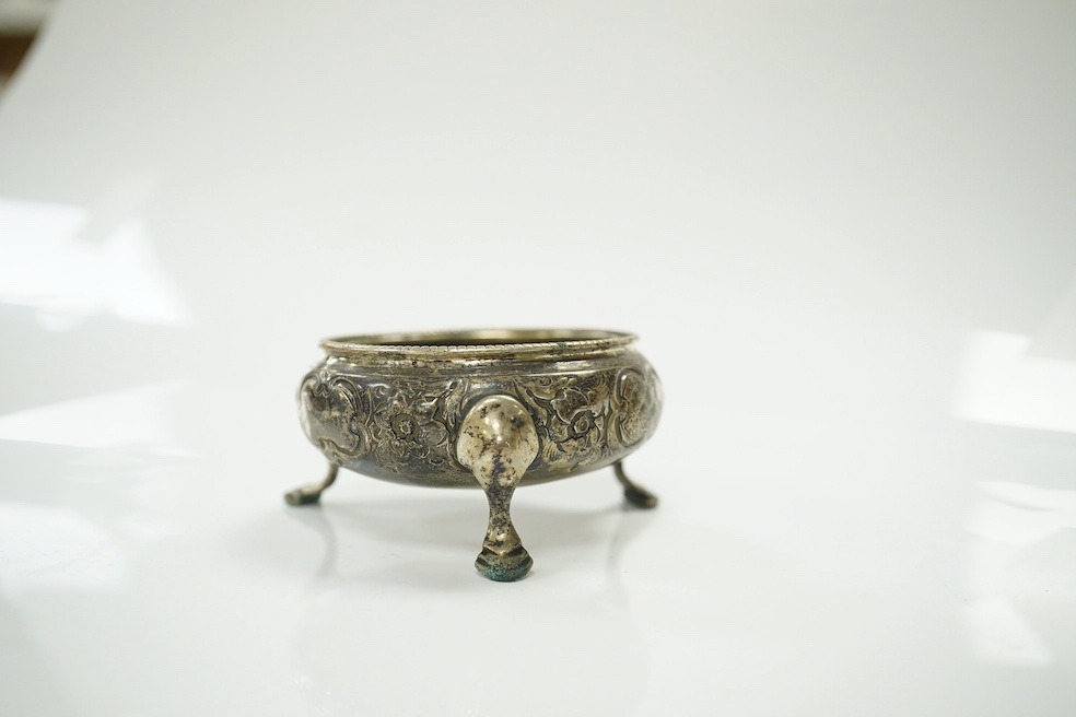 A group of assorted small silverwares including a christening mug, three salts and a pair of mustard pots, 11.5 oz of weighable silver. Condition - fair